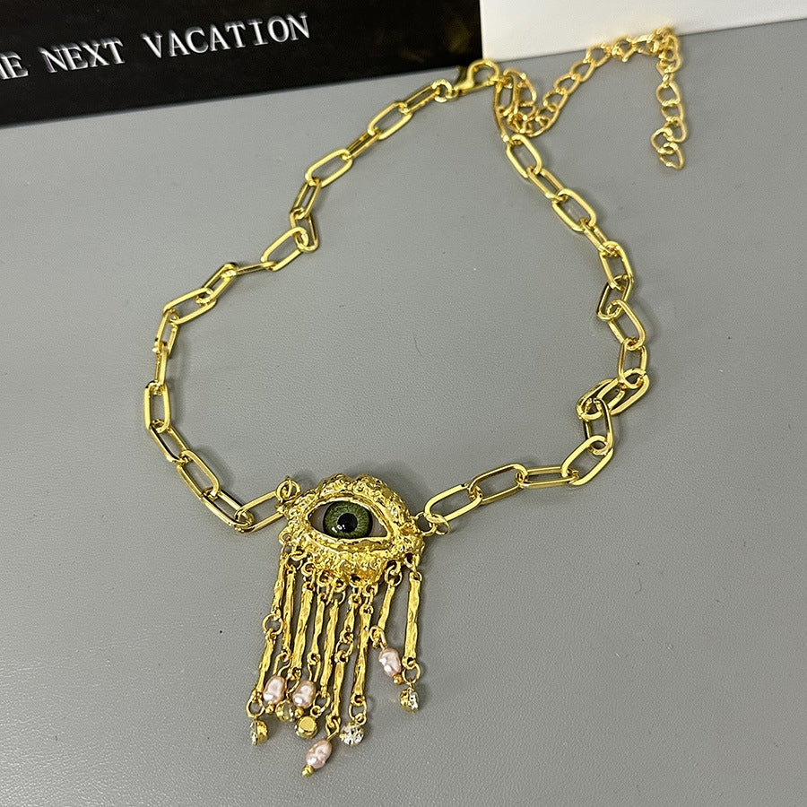 Parure œil du démon et perles – style chic et original