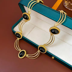 Collier femme Vintage – Métal noir ovale, style rétro, argenté